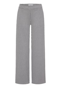 Pantalon à jambes larges pied-de-poule noir et blanc, taille haute avec ceinture élastique, sans poches ni boutons visibles.