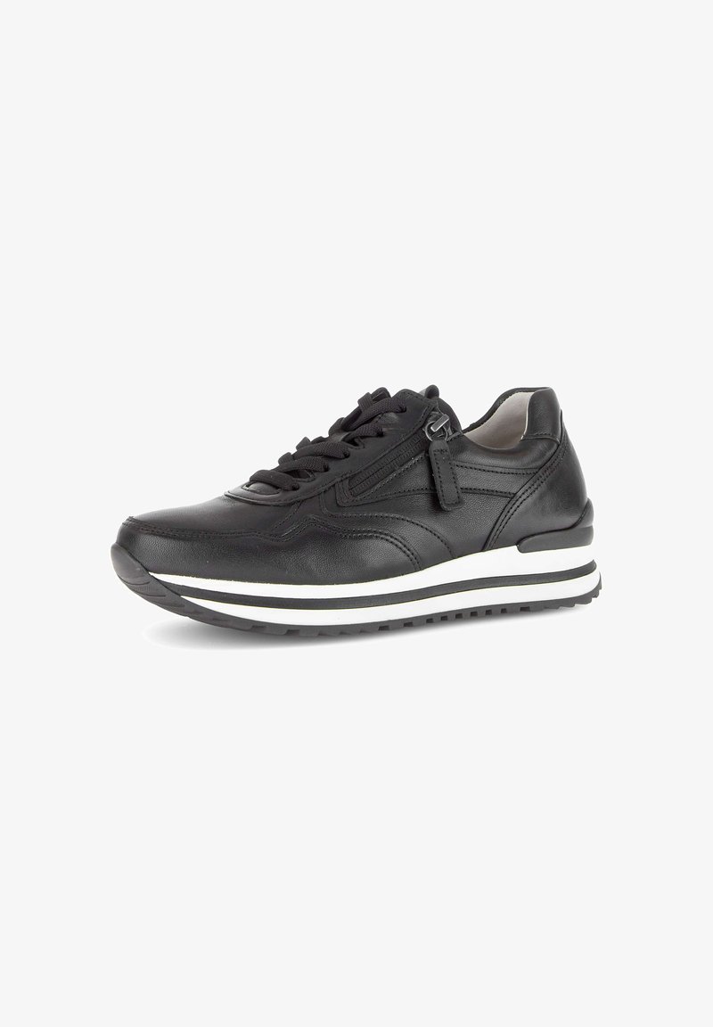 Black leather sneaker with lace-up front, side zipper, white and black striped sole, and padded collar on a white background.