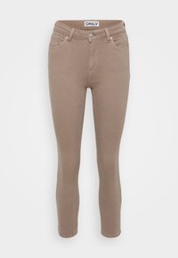 Vaqueros ajustados color beige hechos de denim con una textura suave, con una cintura de altura media, trabillas para cinturón y diseño de cinco bolsillos.