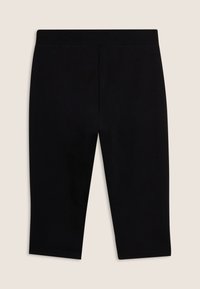 Leggings cortos negros hechos de una tela suave y elástica. Presentan un diseño sencillo con una cintura elástica y sin costuras visibles.