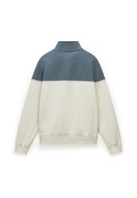 Long-sleeve pullover with a high collar. Color-blocked in cream and muted blue. Soft fabric, relaxed fit with ribbed cuffs and hem.