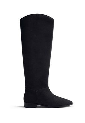 Black suede knee-high boot with a pointed toe, flat heel, and a smooth texture. Minimalist design with no visible hardware or accents.