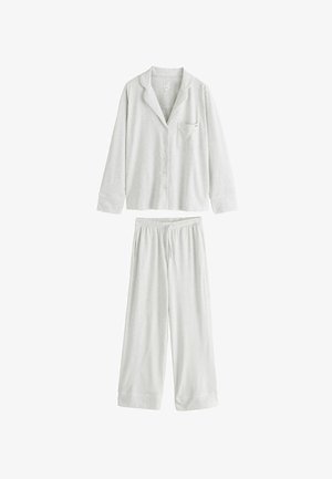 Pigiama grigio chiaro a maniche lunghe con bottone, dotato di taschino sul petto e pantaloni larghi con coulisse coordinati.