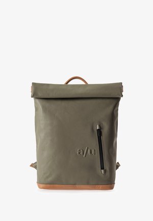 Olive green backpack with a roll-top closure, tan leather accents, a front zip pocket, and embossed logo on the front.