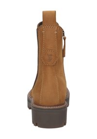 Botín de cuero marrón con un acabado suave, logotipo hexagonal en la parte posterior y suela de goma gruesa con costuras detalladas.