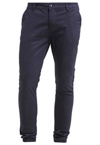 Tmavě modré zúžené chinos kalhoty vyrobené z měkké látky, s předním zapínáním na knoflík, bočními kapsami a elastickými manžetami na kotnících.