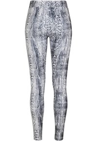 Aukštos juosmens leggings su juodai-balta gyvatės odos raštu, pagamintos iš tamprios medžiagos su lygiu paviršiumi.