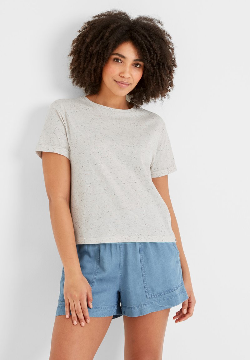 Light gray, short-sleeve t-shirt with a relaxed fit and speckled texture, paired with light blue, loose-fitting denim shorts.