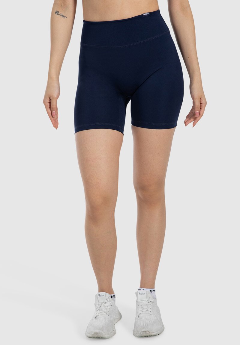 Shorts atletici a vita alta blu navy con una texture liscia e materiale elasticizzato, caratterizzati da un design aderente e lunghezza a metà coscia.