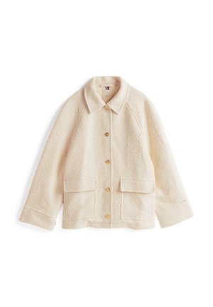 Off-white, gestructureerde jas met een kraag, gouden knopen sluiting en twee voorzakken. Heeft een relaxed fit en raglan mouwen.