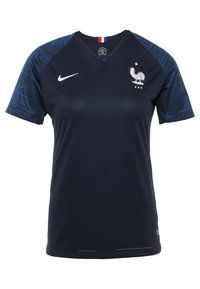 Camiseta de la selección nacional de fútbol de Francia en azul oscuro con el logo de Nike, emblema del gallo blanco y mangas de un patrón en azul marino.