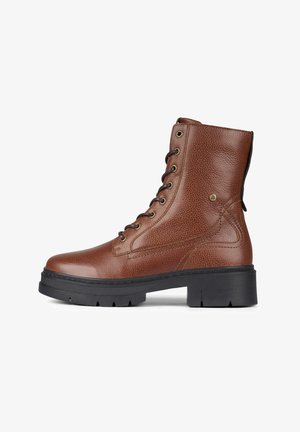 Brown leather ankle boot with a textured finish, lace-up front, and a chunky black rubber sole. Features metal eyelets and stitching details.