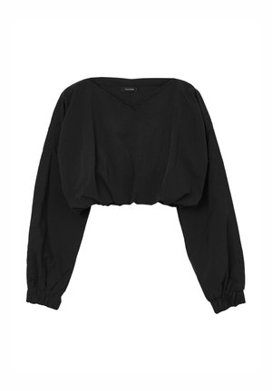 Pull noir court avec de longues manches bouffantes, un décolleté en V et des poignets élastiques. Fabriqué à partir d'un tissu doux avec une texture lisse.