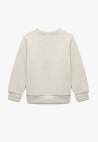 Jasno beżowy sweatshirt wykonany z miękkiego materiału. Posiada długie rękawy i ściągacze przy mankietach. Prosty, teksturowany design z okrągłym dekoltem.