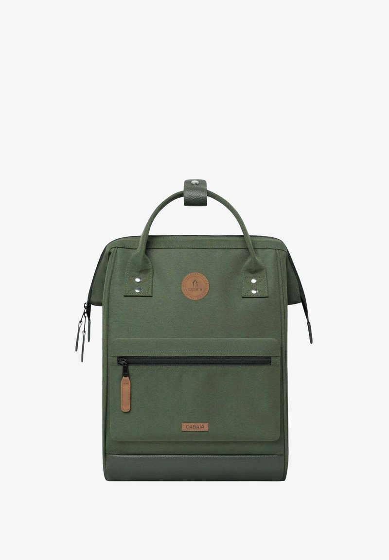 Green fabric backpack with a top handle, front zip pocket, leather accents, and circular logo patch. Features reinforced stitching and a sleek design.