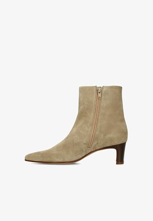Light brown suede ankle boot with a side zipper and low stacked heel, shown in a right-side profile view.