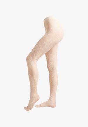 Béžové těhotenské punčocháče s krajkovým vzorem na průsvitném materiálu, vystavené na figuríně s mírně pokrčenou nohou vpřed.