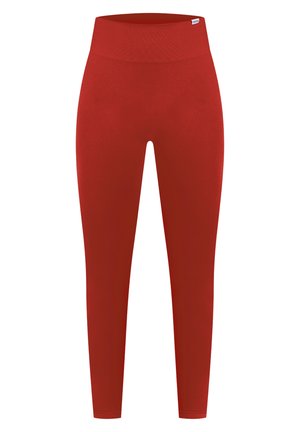 Czerwone legginsy wykonane z elastycznego materiału, charakteryzujące się wysokim stanem, bezszwowym designem i gładką, matową powierzchnią.