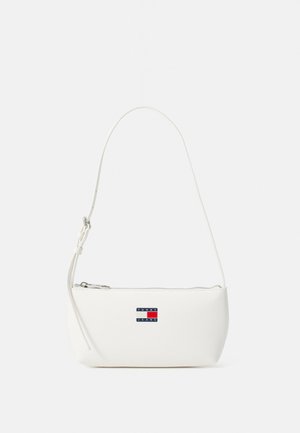 White leather shoulder bag with a curved shape, zip closure, and a small logo patch in blue, red, and white on the front.