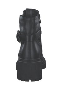 Black leather ankle boot with a textured sole, featuring a buckle accent and zipper closure at the back, sturdy construction, and minimal embellishments.