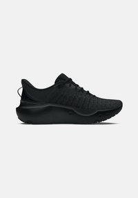 Zwarte sportieve schoenen met een ademende gebreide bovenkant, gewatteerde zool en textuurdetails aan de zijkanten. Minimalistisch ontwerp en slanke silhouet.