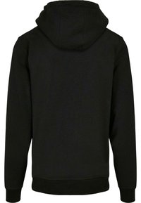 Svart hoodie med snörning i huvan, ribbade muddar och nederkant. Tillverkad av ett mjukt, tjockt tyg med en enkel, slät yta.