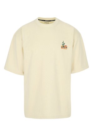 Roomkleurig T-shirt met korte mouwen, voorzien van een kleine cactusafbeelding en golvende strepen op de bovenste linkerborst.