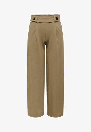Pantalons larges dans une teinte brun clair, fabriqués à partir d'un tissu lisse. Possède une taille haute avec deux boutons noirs et des plis à l'avant.