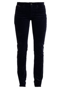 Navy sininen corduroy-housut slim fit -mallilla, joissa on teksturoitu pinta, viisi taskua ja kultaiset yksityiskohdat.