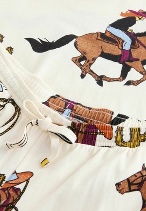 Šorts s rastezljivim pojasom izrađen od laganog materijala, s grafičkim uzorkom cowboya i konja na krem pozadini.