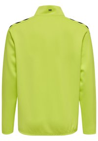Lange mouwen jasje in fel neon geel, gemaakt van gladde stof met een hoge kraag. Heeft zwarte accentstrepen op de schouders.