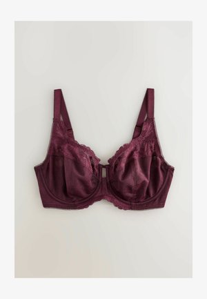 Sügav burgundi alusega spAndage rinnahoidja, millel on pitsäär ja reguleeritavad rihmad, heleda tausta peal.