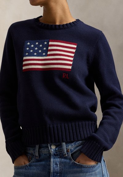 Navy knit sweater featuring an embroidered American flag pattern on the front, with a ribbed neckline and hem. Subtle "RL" embroidery.
