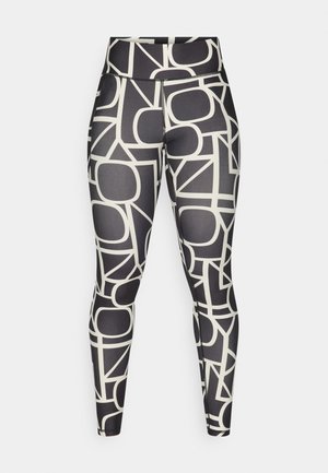 Juodos aukštos liemens legginsai su dideliu, ryškiu abstrakčiu balto rašto, pasiūti iš lygaus, tamprios medžiagos ir prigludusio dizaino.