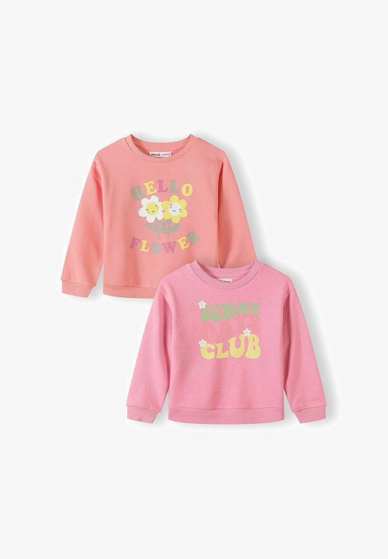 Deux sweat-shirts pour enfants roses, l'un avec "HELLO FLOWER" et des fleurs souriantes, l'autre avec "SUNNY CLUB" et de petits motifs de fleurs.