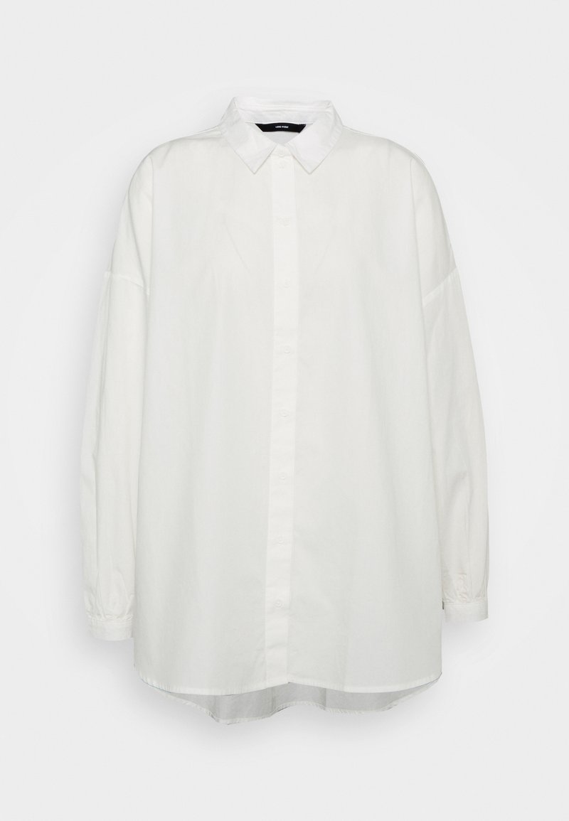 Chemise blanche à manches longues, coupe ample, col, manches avec poignets et ourlet légèrement arrondi.