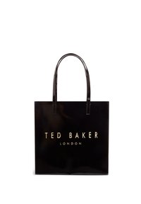 Μαύρη γυαλιστερή τσάντα ώμου με δύο μακριές λαβές, με χρυσά γράμματα «TED BAKER LONDON» στο μπροστινό μέρος. Ορθογώνιο σχήμα, λεία υφή.
