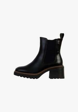 Bottine en cuir noir avec panneaux élastiques latéraux, bout rond, talon texturé et détails de couture contrastés. Semelle en caoutchouc avec motif de traction.