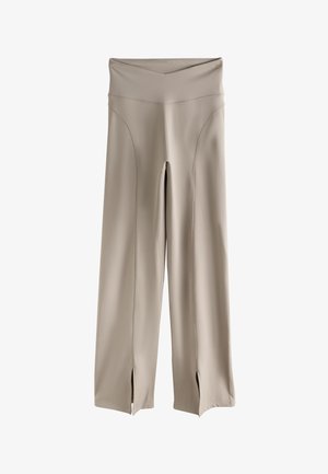 Béžové nohavice s širokými nohavicami, vysokým pásom a prednými rozparkami na manžetách, vyrobené zo hladkej elastickej látky.