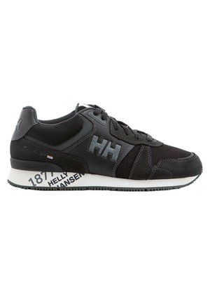 Zapatillas deportivas negras que combinan materiales de cuero y malla, con puntera redondeada, acentos texturizados y una marca impresa en la suela.