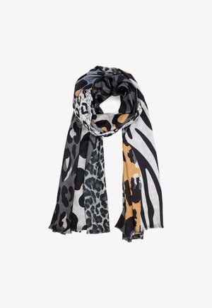 Sciarpa con motivi di stampa animale misti in nero, grigio, bianco e giallo senape, disposta a loop allentato con bordi frangiati.
