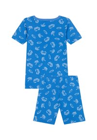 Ensemble de pyjama en coton bleu comprenant un haut à manches courtes et un short. Le motif inclut des palmiers blancs, des vans et des planches de surf. Texture douce.