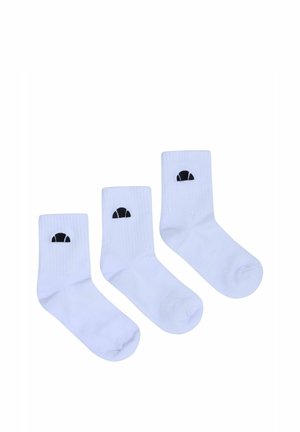 Tre paia di calzini bianchi da equipaggio con loghi a mezzaluna neri, disposti in fila su uno sfondo bianco.