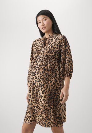 Leopard print dress made of soft fabric, featuring a belted waist, long puff sleeves, and a round neckline.