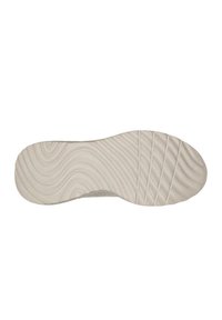 Suola di una scarpa, caratterizzata da un texture con ondulazioni e linee orizzontali, prevalentemente in beige chiaro, con una finitura liscia.