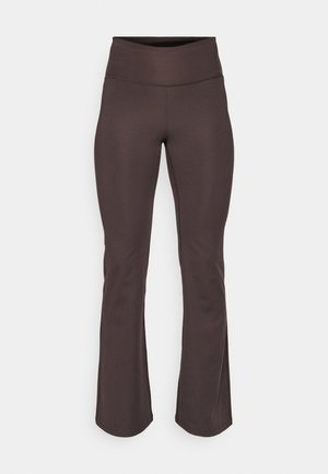 Brown, flared workout pants made of stretchy fabric. High waistband with smooth texture and no visible patterns or accents.