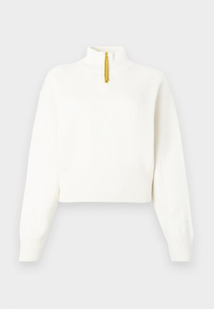 Biely cropped pulóver s dlhými rukávmi, s rebrovými manžetami a spodným okrajom, žltým polovičným zipsom a vyrazeným logom North Face na prednej strane.