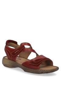 Rote Leder-Sandale mit überkreuzten Riemen, offenes Zehendesign und genähten Akzenten. Geformte braune Sohle, strukturiert für Grip und Komfort.