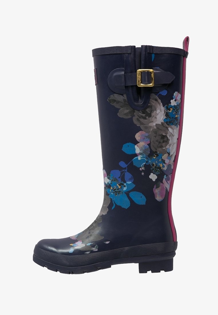 Navy blue tall rain boot with floral pattern in blue, pink, and gray, featuring a side buckle and a pink heel pull tab.