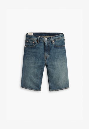 Kuldsinised teksaded šortsid, millel on sirge lõige ja pleekinud värv. Omavad viit taskut, vase tooni neete ja õmmeldud äärt.